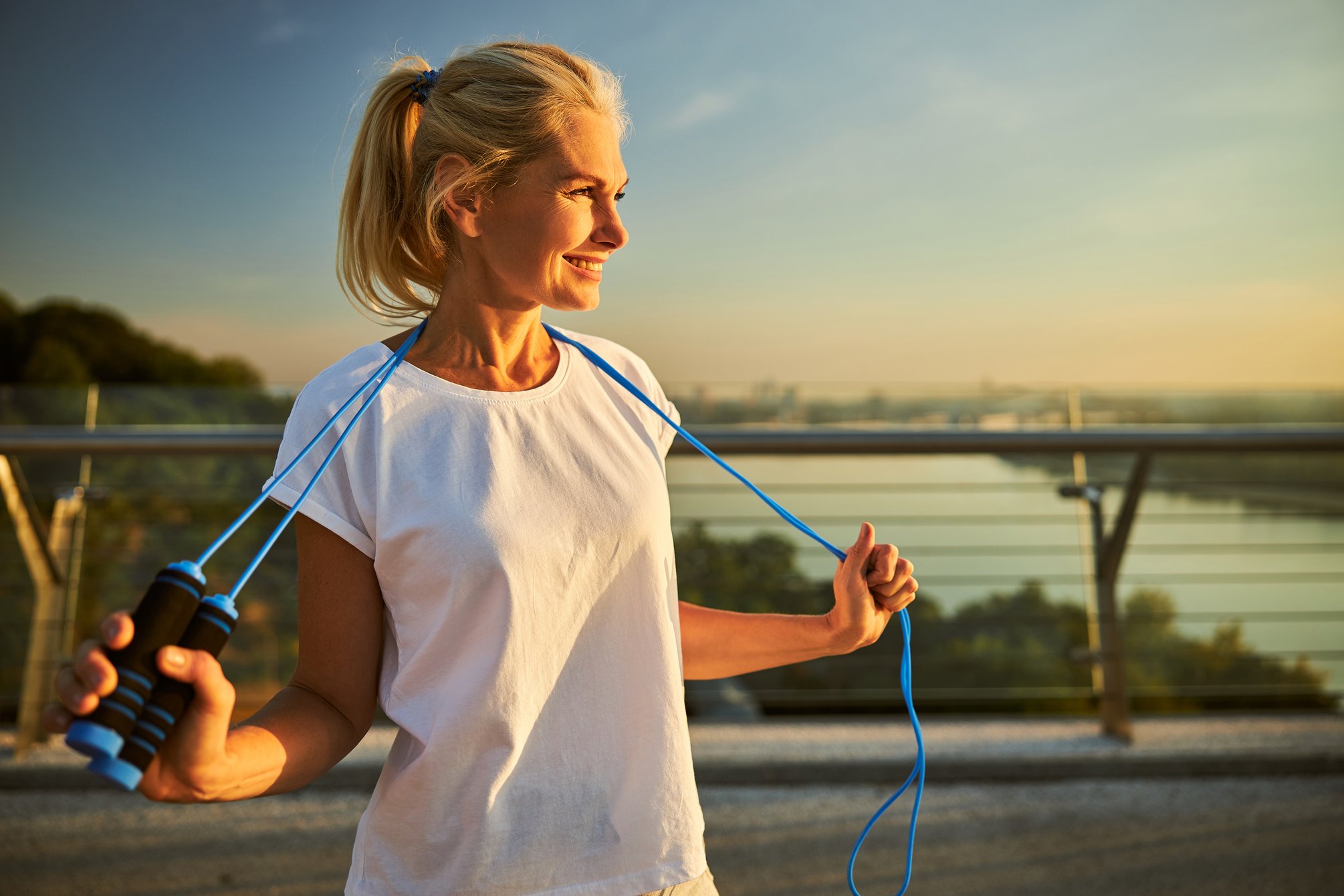 cheerful-woman-with-skipping-rope-standing-on-the-2025-03-07-09-02-18-utc