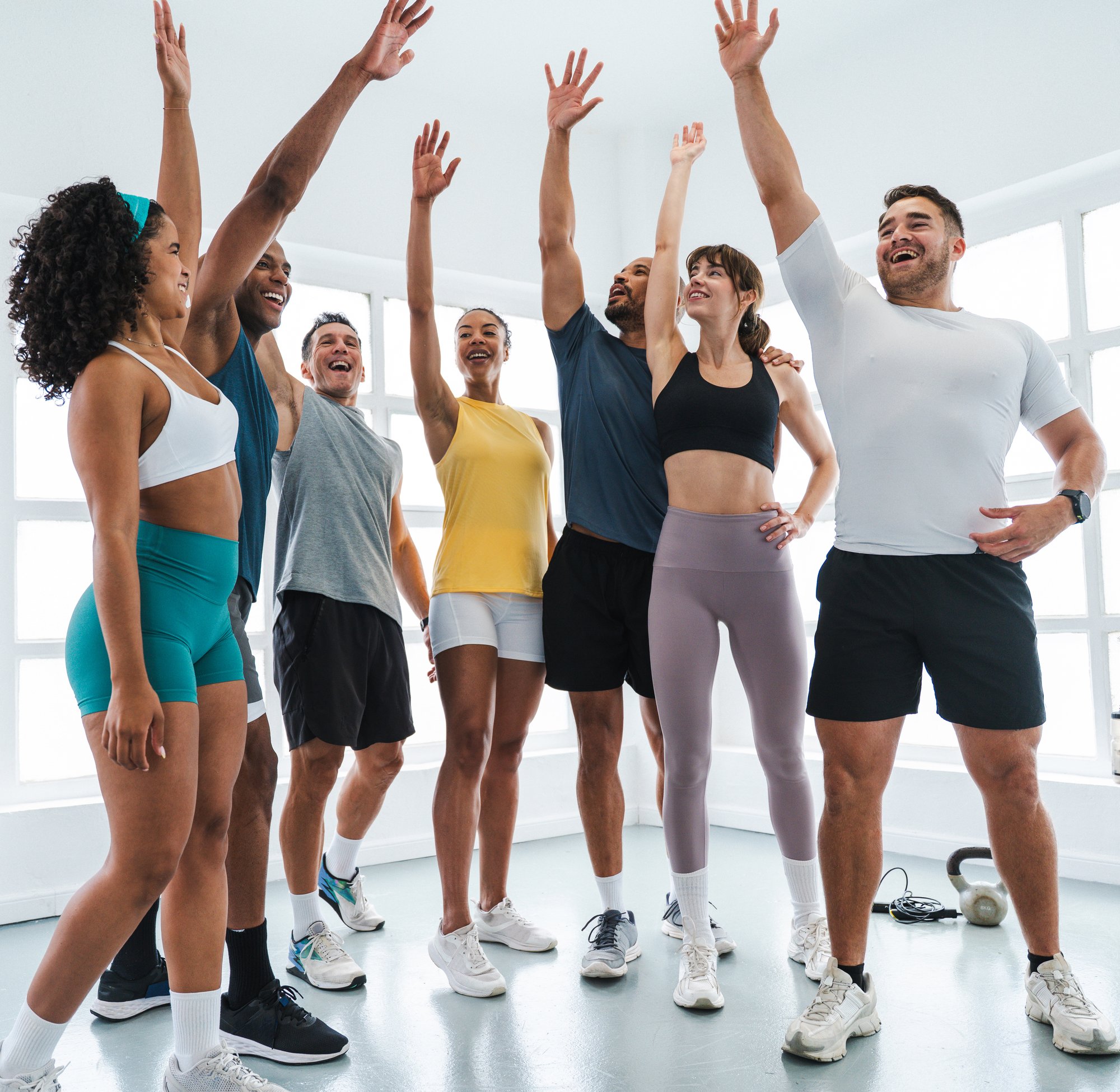 group-of-happy-athletes-cheering-with-raised-arms-2025-08-02-22-58-52-utc-1