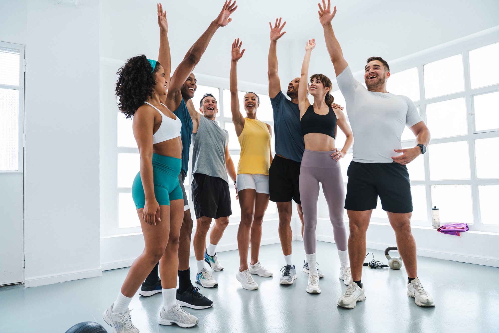 group-of-happy-athletes-cheering-with-raised-arms-2025-08-02-22-58-52-utc